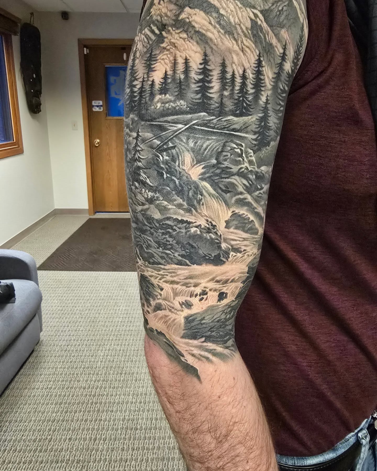 Mountain landscape realism tattoo on the forearm by Alexander L. Wolff, Rapid City, South Dakota