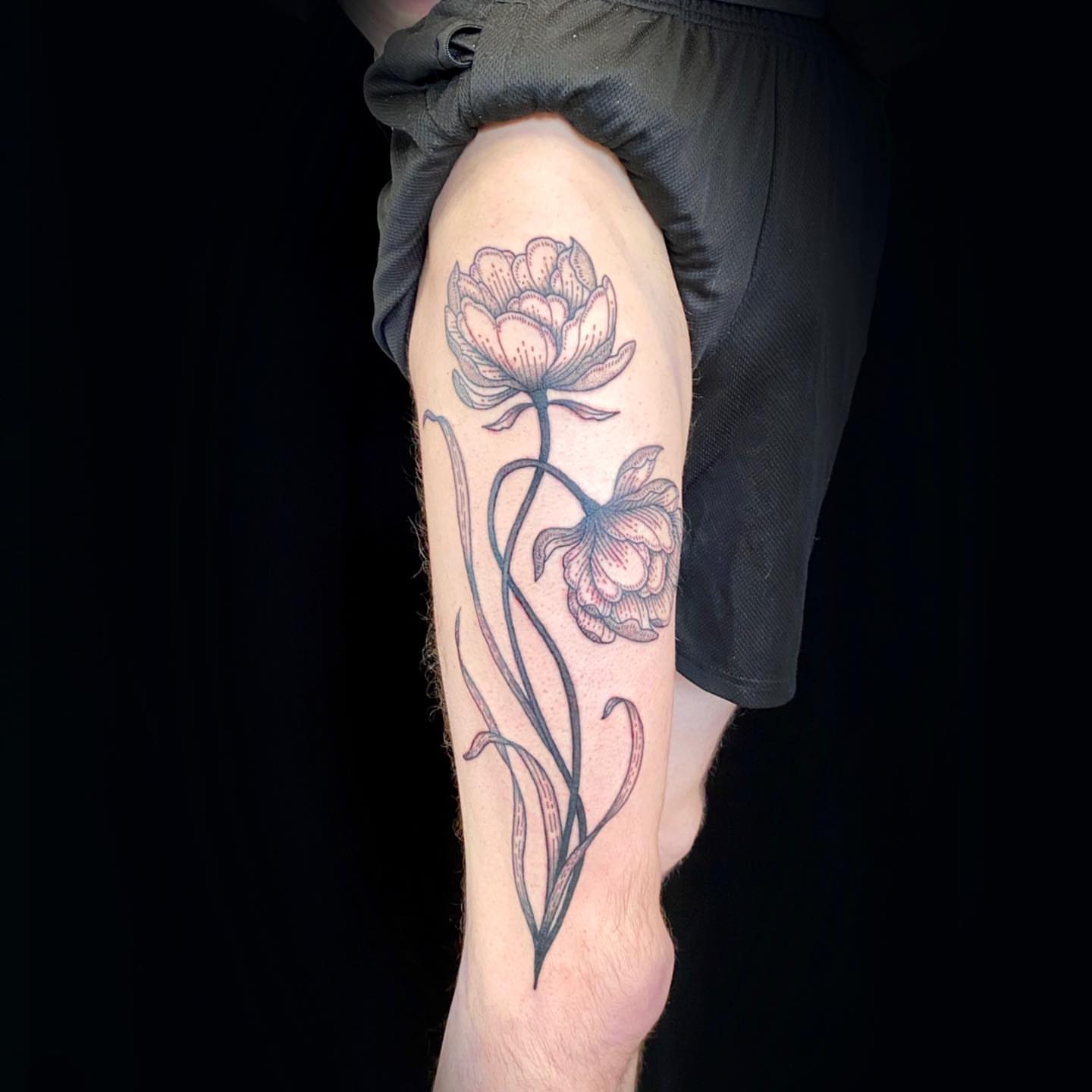 Flowers black and grey tattoo on the forearm by Krista - Tattoo Artist