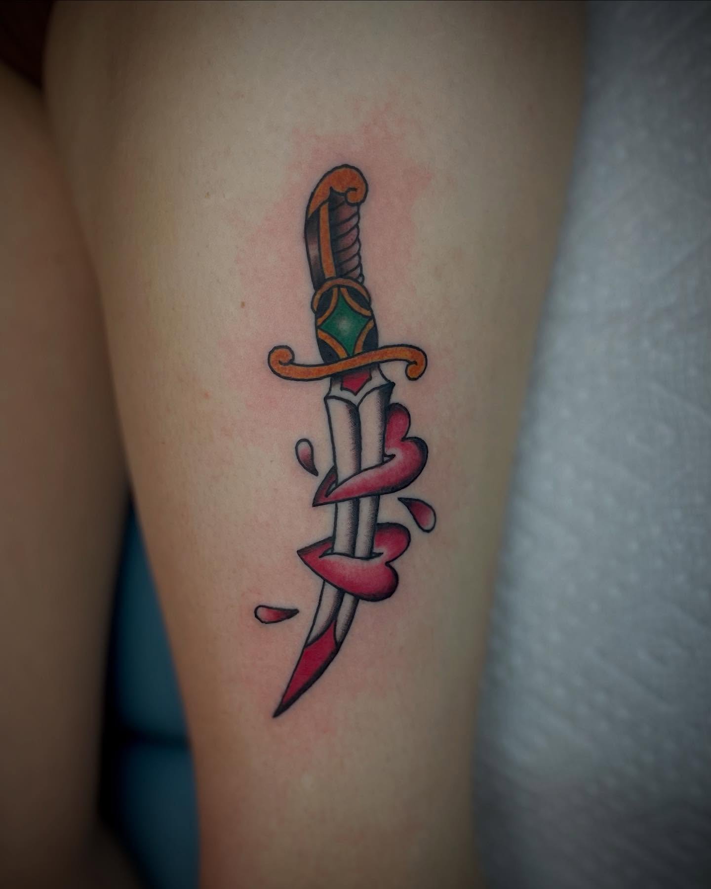 Sword and heart American traditional tattoo on the forearm by JD Bassett