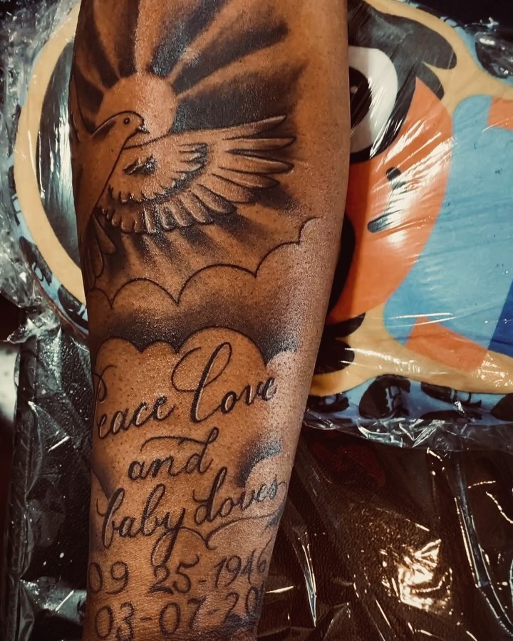 Peace love baby doves black and grey tattoo on the forearm by Nessa, Las Vegas, Nevada
