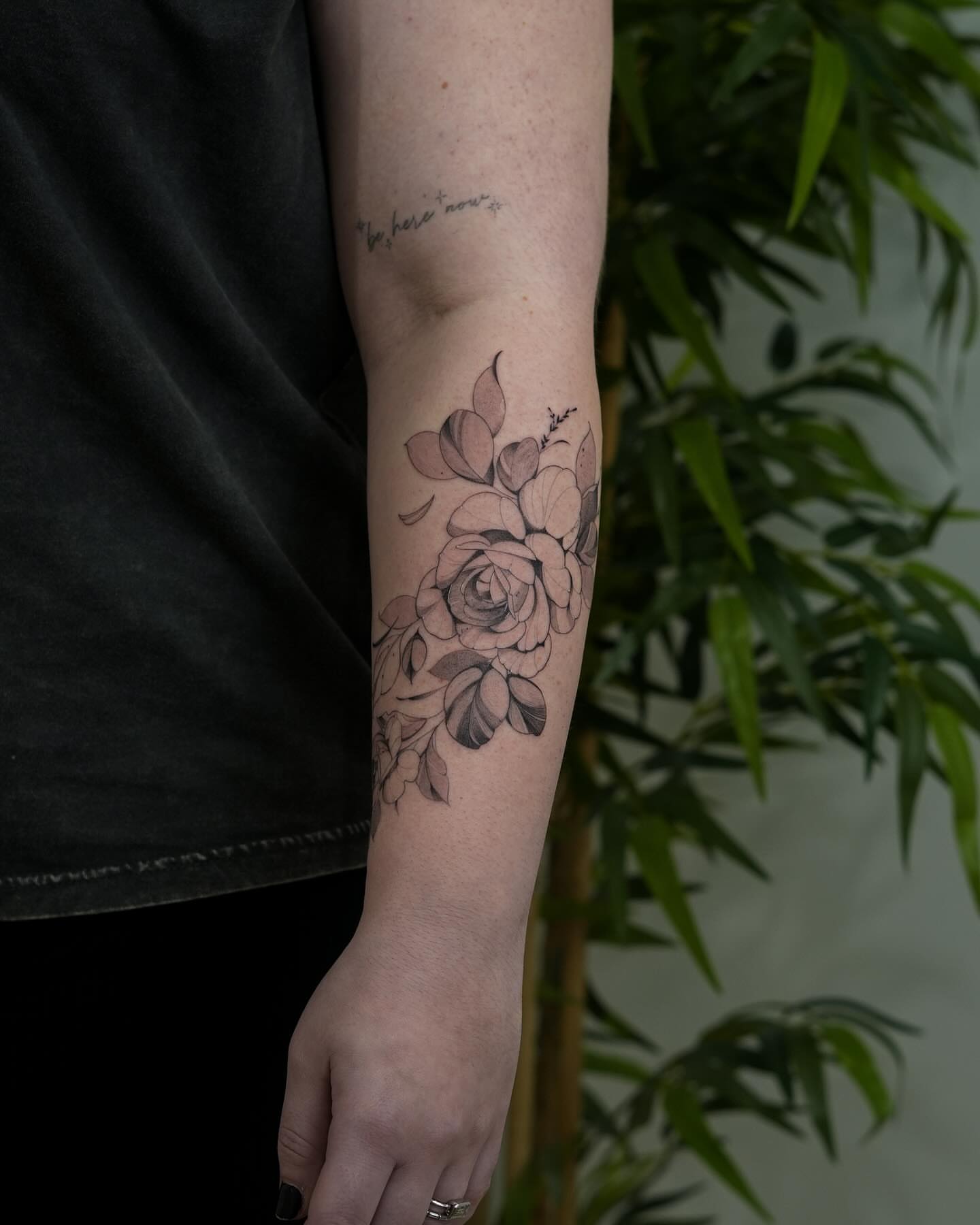 Floral bouquet black and grey tattoo on the forearm by Adriano Bassalo