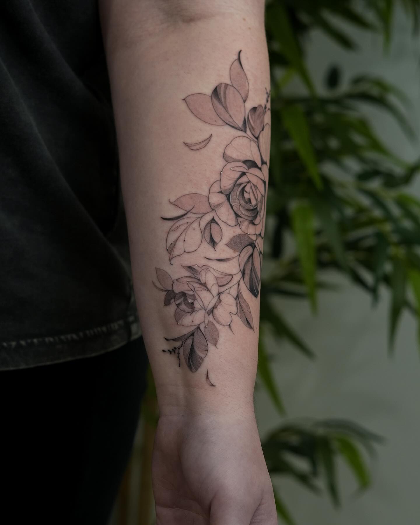 Flowers black and grey tattoo on the forearm by Adriano Bassalo