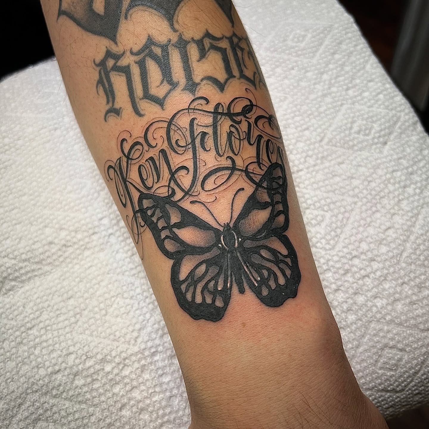 Butterfly black and grey tattoo on the forearm by $krypt