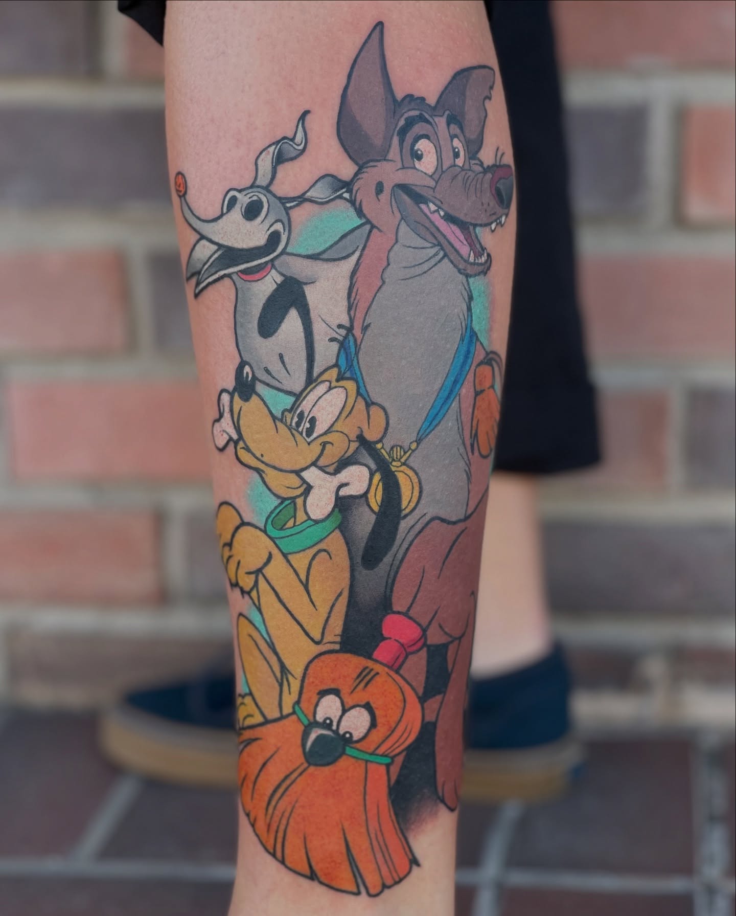 Cartoon dogs new school tattoo on the forearm by James Mullin