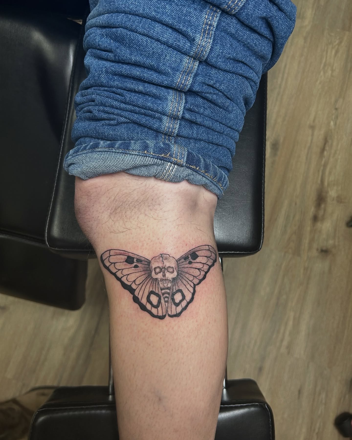 Moth with skull black and grey tattoo on the forearm by Jessica π