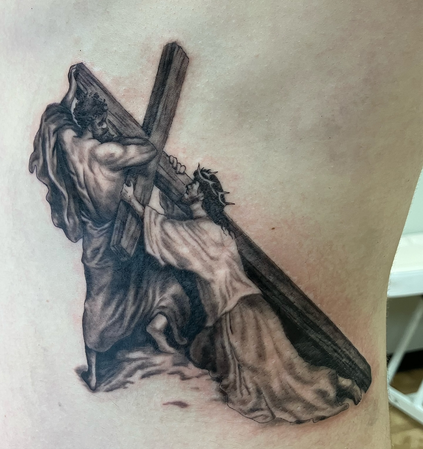 Jesus carrying cross realism tattoo on the thigh by Hunter McGinnis