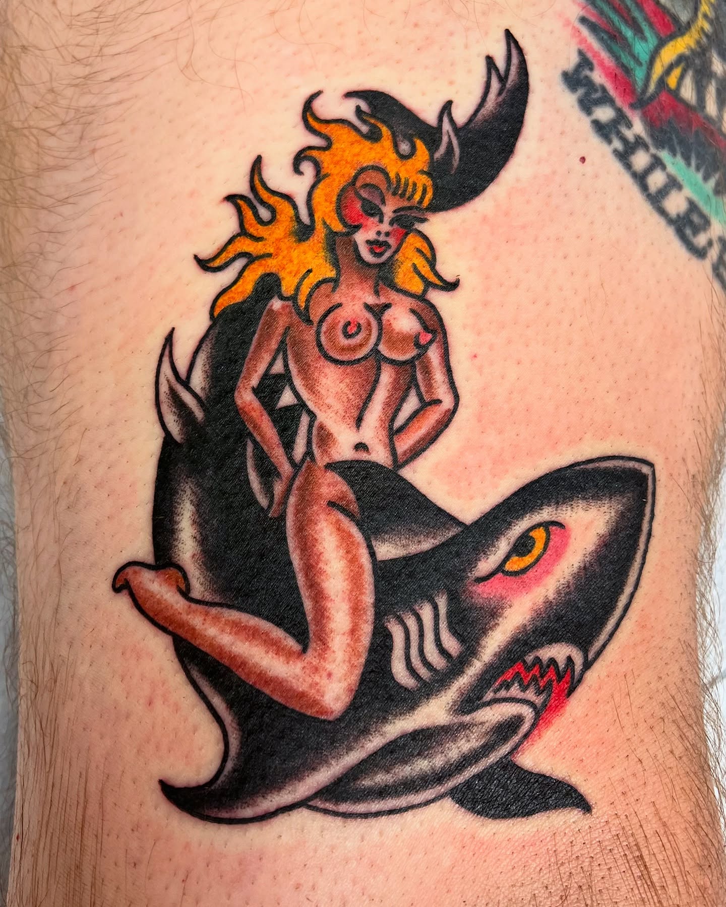 Mermaid riding shark American traditional tattoo on the thigh by Graham Niles