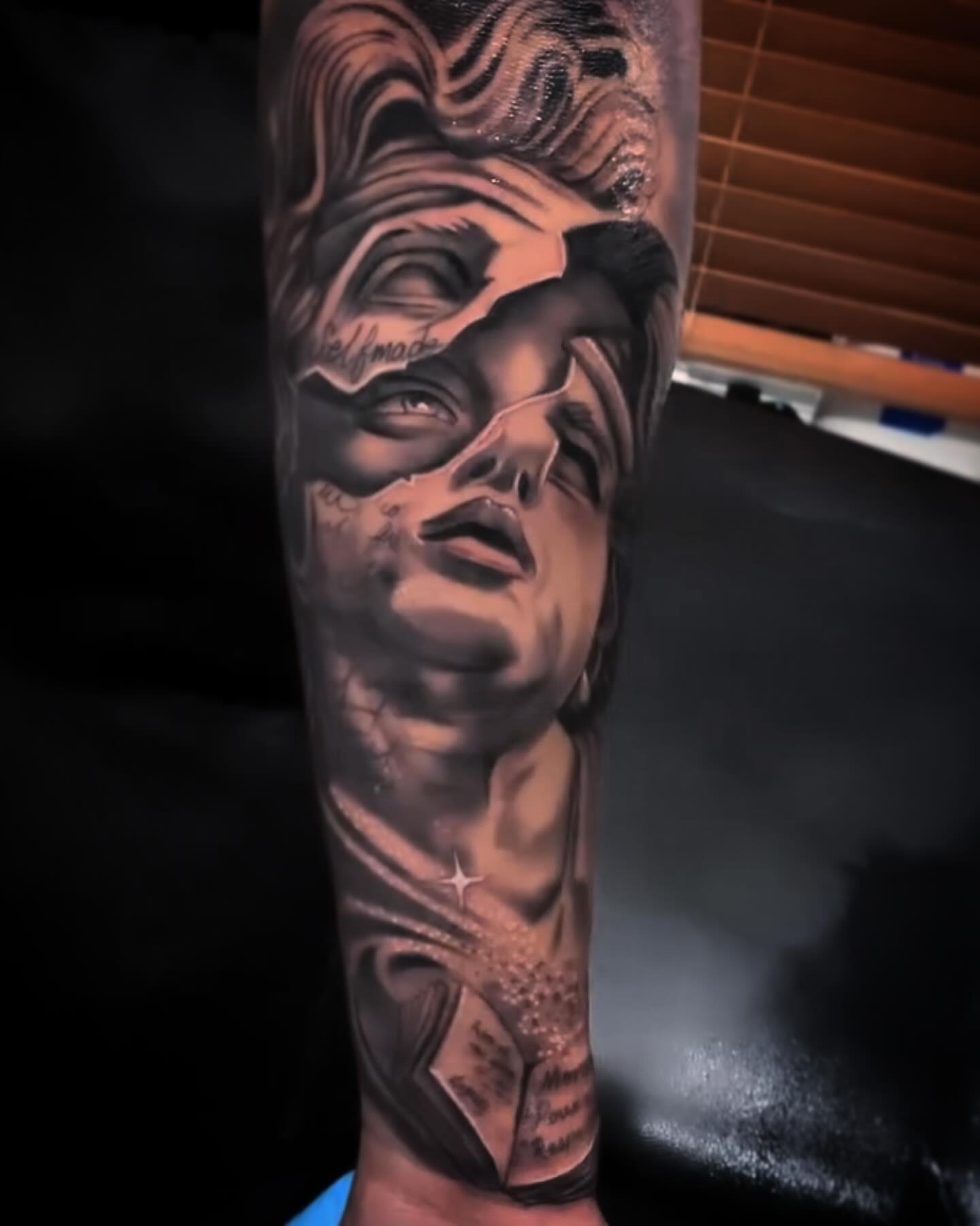 Portrait realism tattoo on the forearm by Tattoos in Fort Myers, Fl