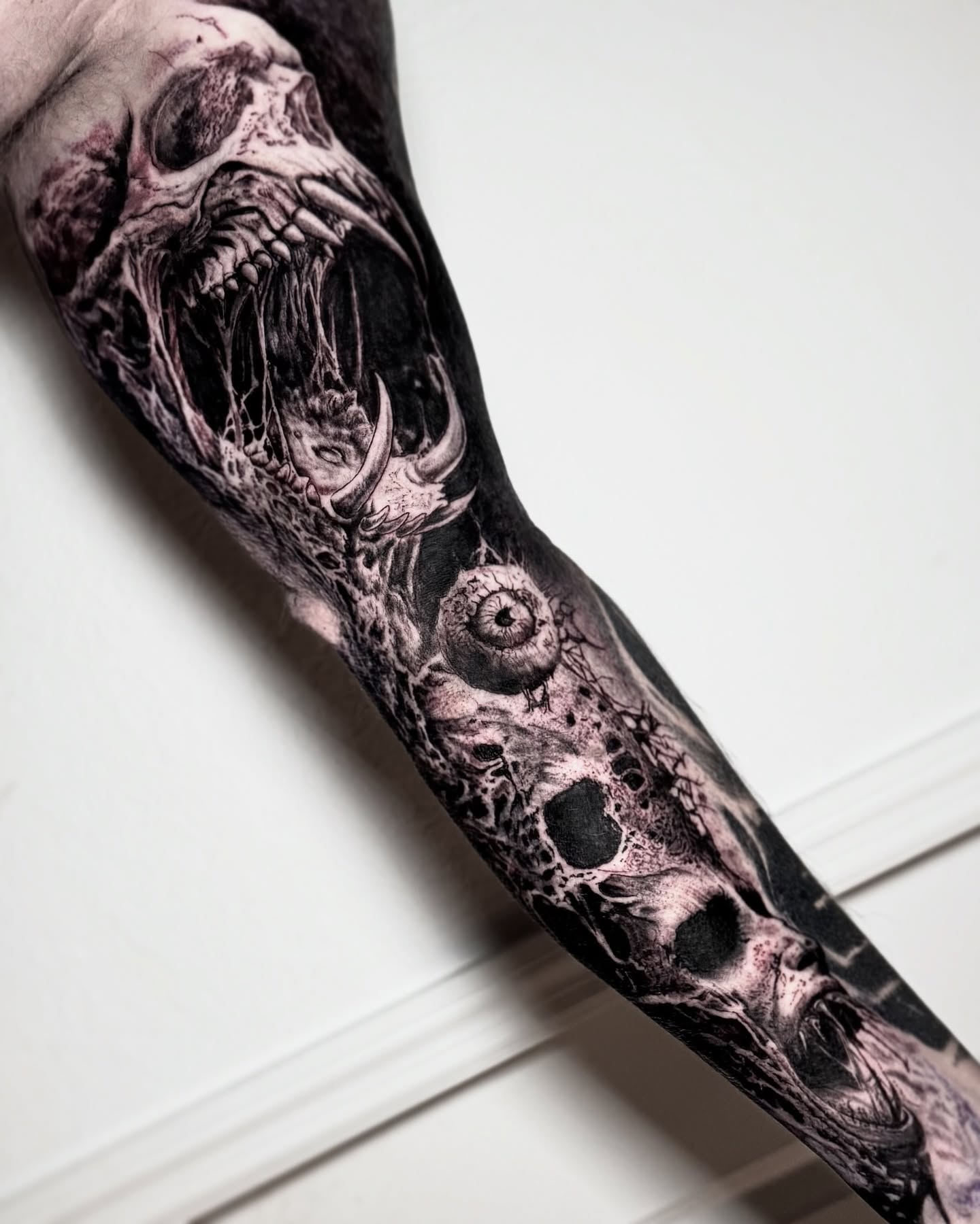 Skull and eyeball dark realism tattoo on the forearm by Maverick Mayes🕷