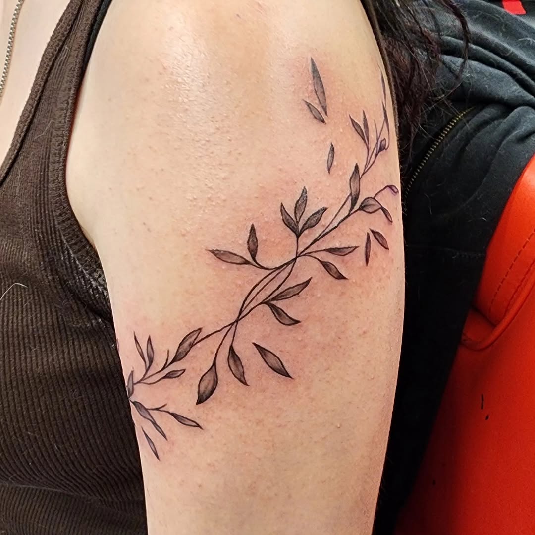 Vine with leaves cyber sigilism tattoo on the shoulder by @thedevilspaintbrush_