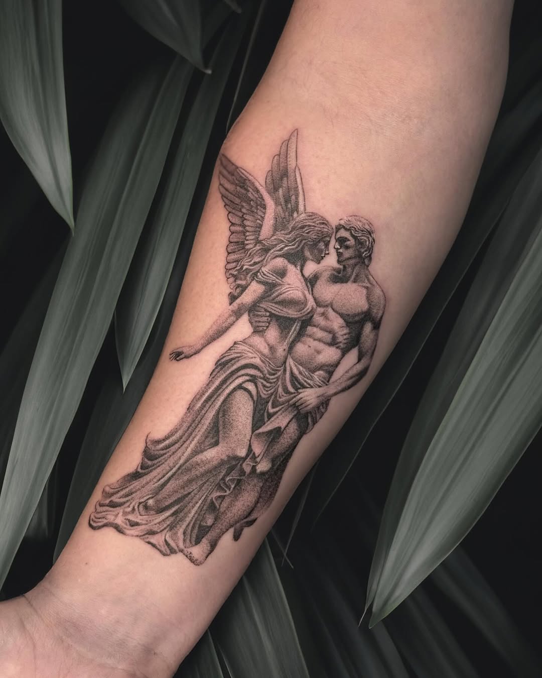 Angel and man embracing realism tattoo on the forearm by โ๏ธ Dima Sova โ๏ธ Tattoo ๐บ๐ธ Arlington VA