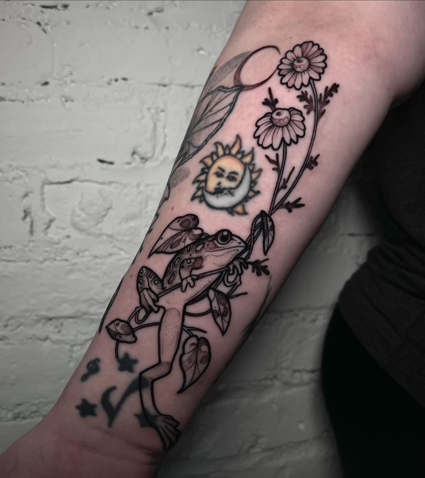 Frog and sun realism tattoo on the forearm by H A N N A H, Colorado Springs, Colorado