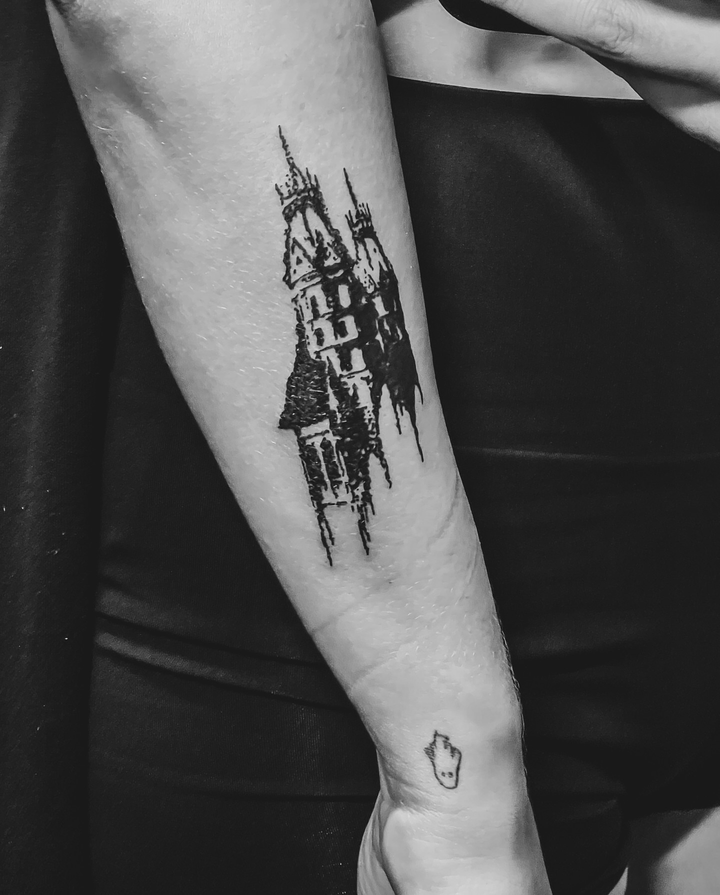Castle black and grey tattoo on the forearm by Amy
