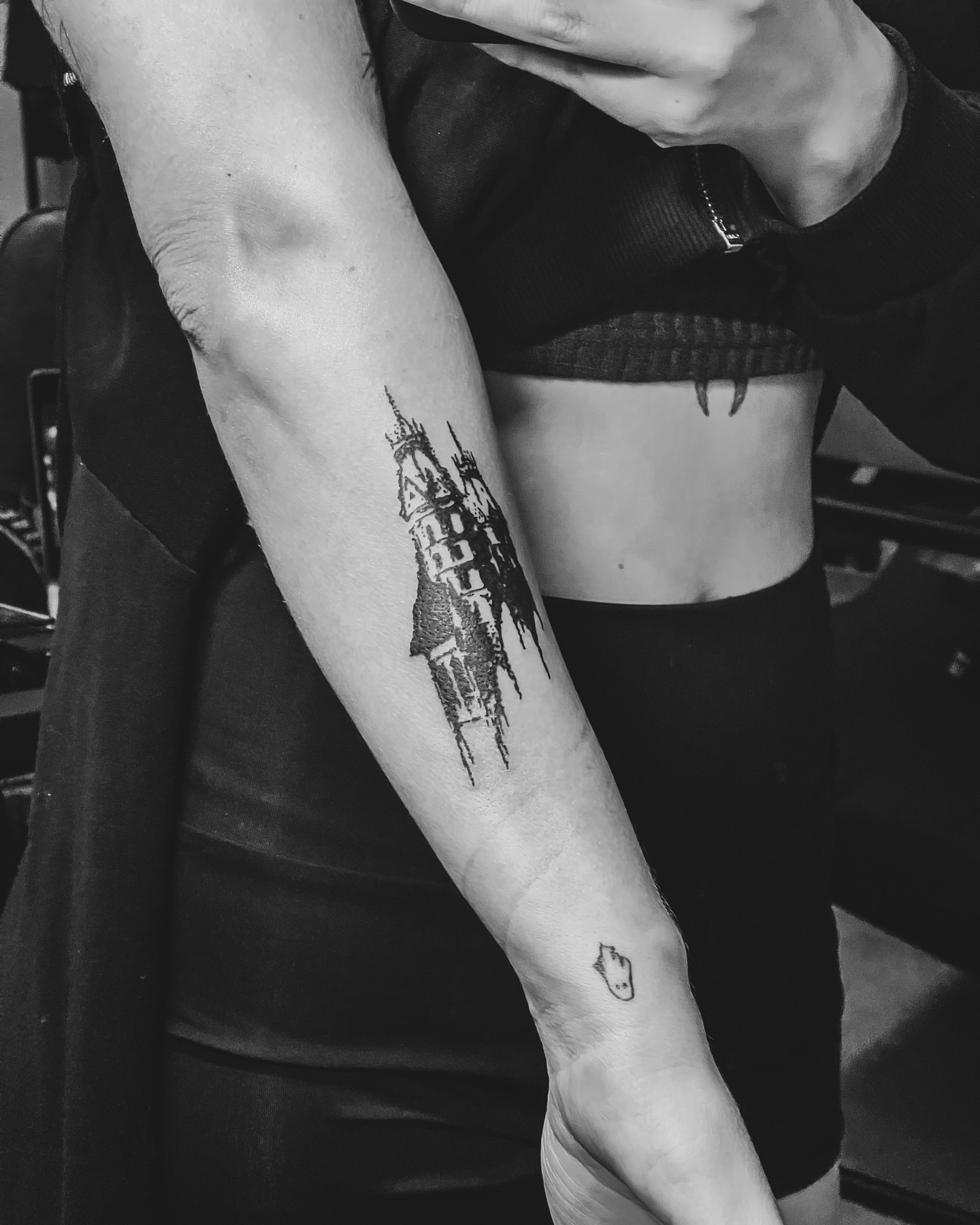 Castle black and grey tattoo on the forearm by Amy