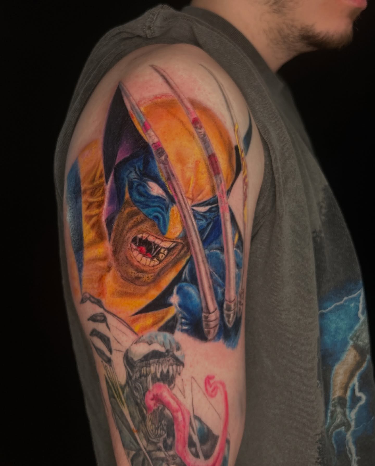 Wolverine realism tattoo on the upper arm by Haley