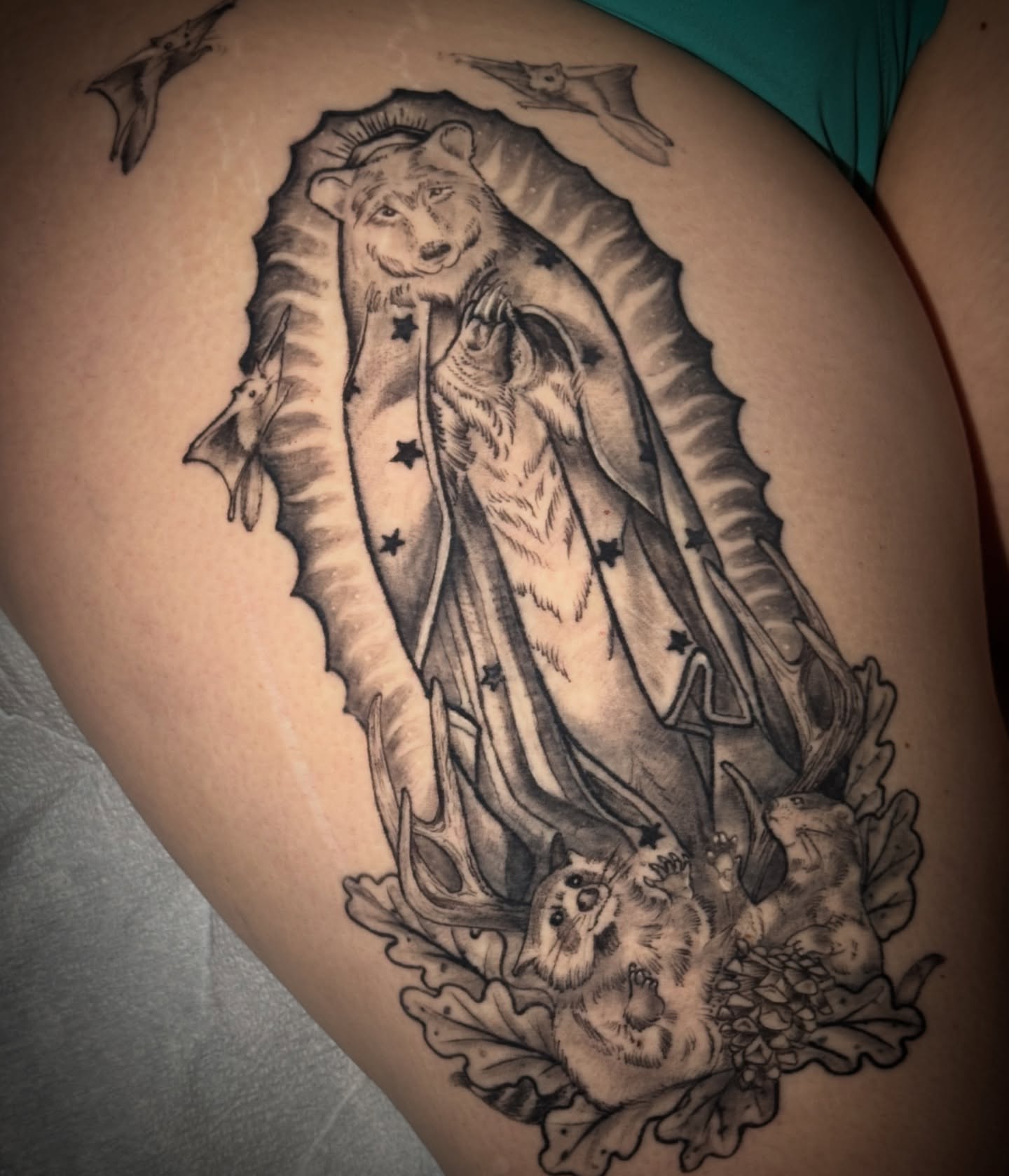 Guadalupe Virgin black and grey tattoo on the thigh by đź’›Kristinađź’› tattoos with intention, Minneapolis, Minnesota