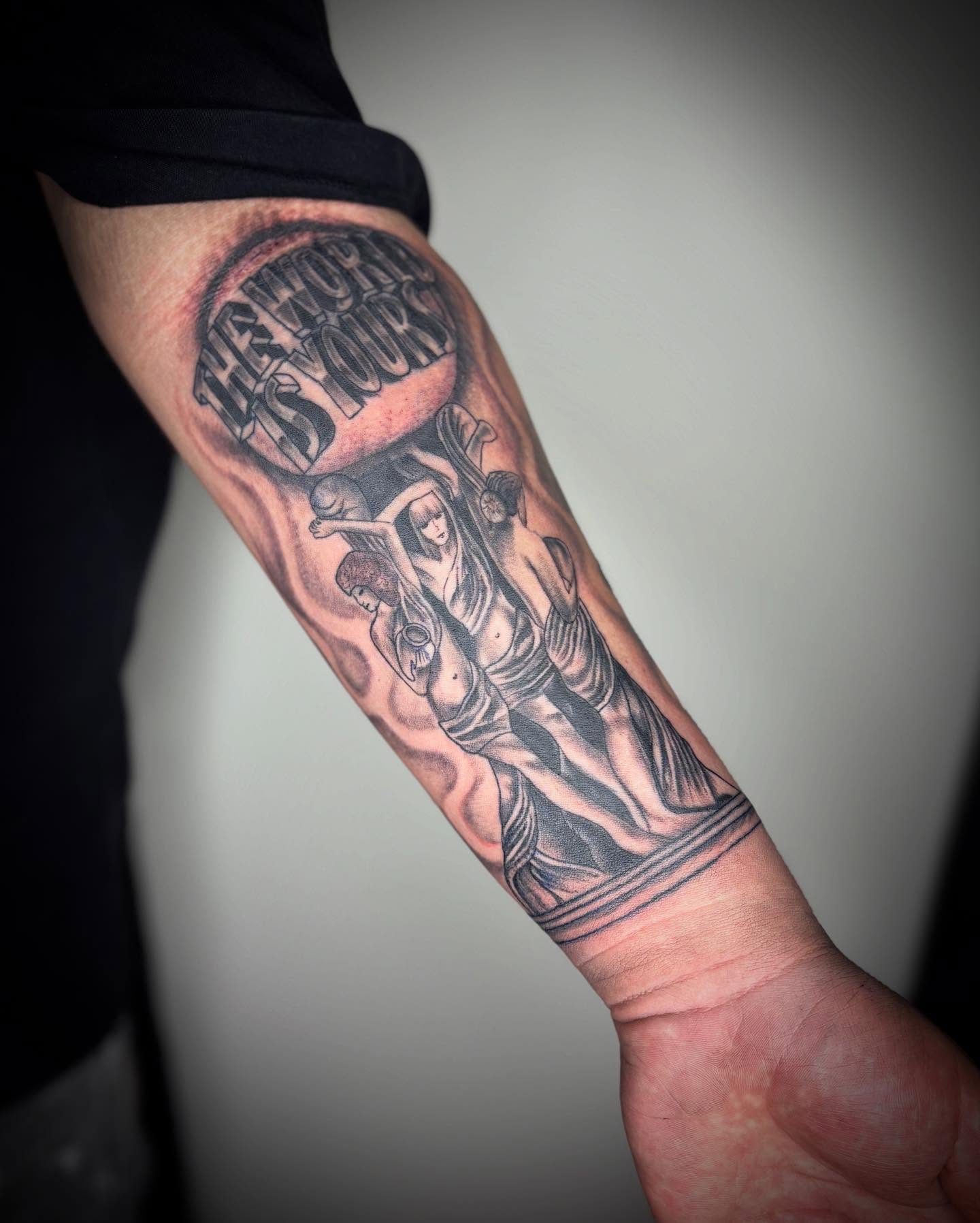 Statue with speech bubble black and grey tattoo on the forearm by Adrian Ram 🇬🇾🇵🇭