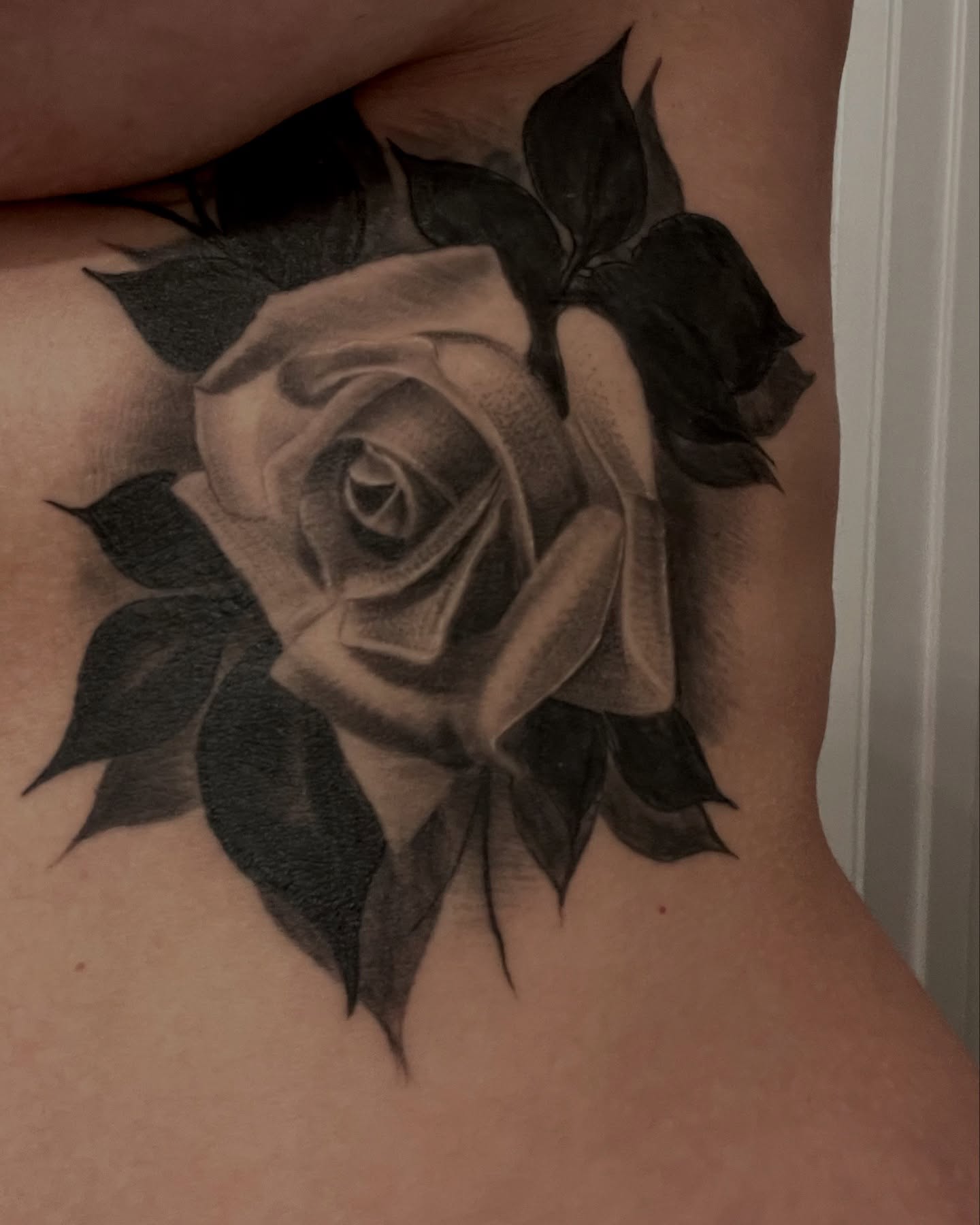 Rose realism tattoo on the ribs by Andy