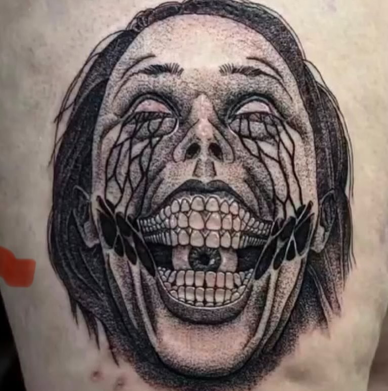 Grinning skull dotwork tattoo on the forearm by William Worley