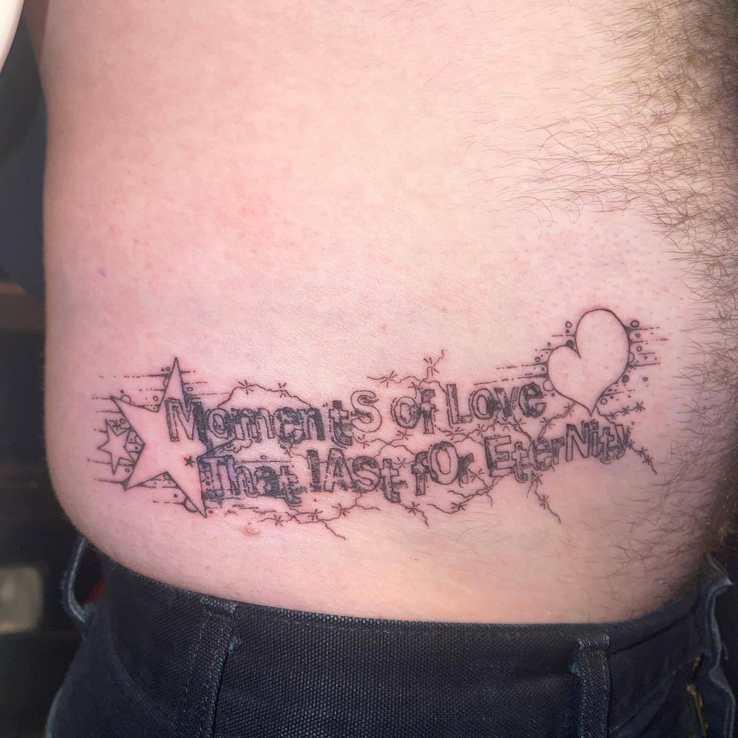 Moments of Love That Last Forever lettering script tattoo on the ribs by @initiationoftorture