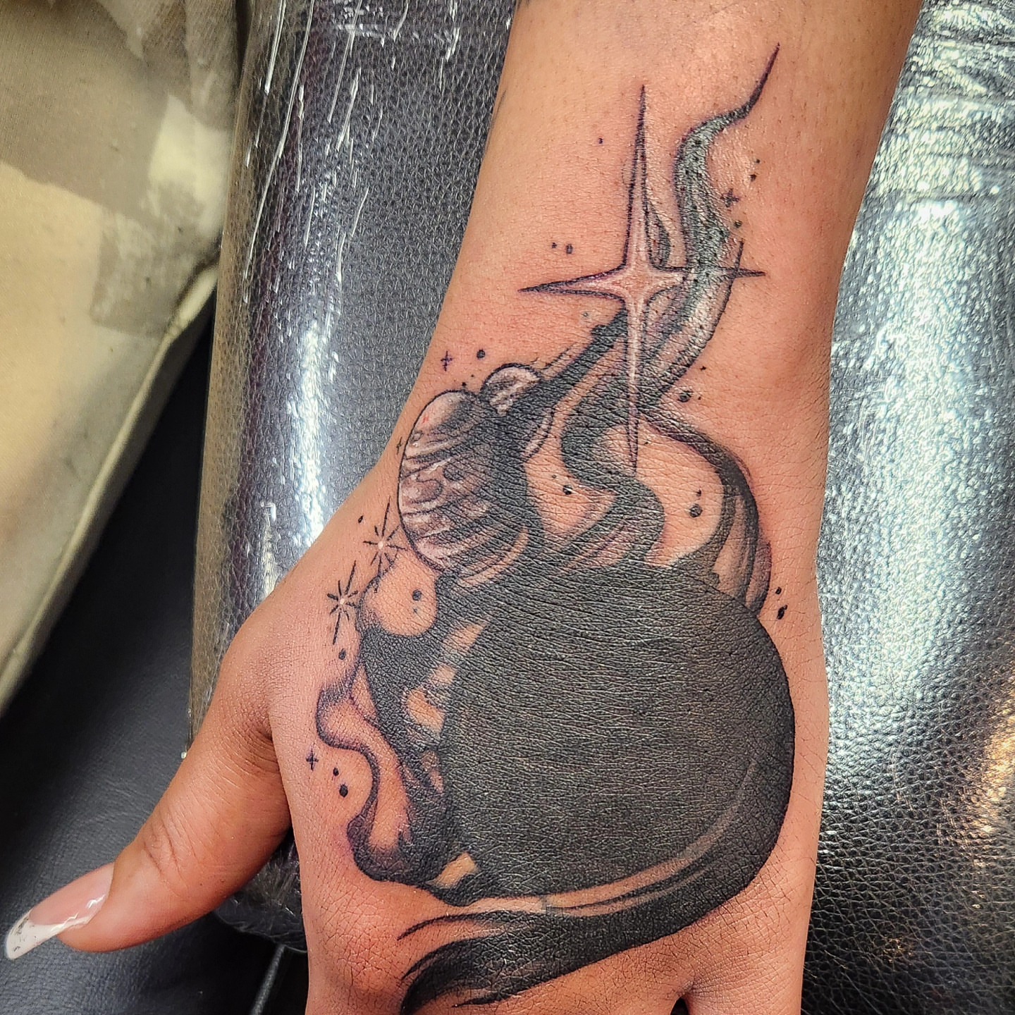 Astronaut in space realism tattoo on the forearm by Samantha Von Zombia, Saint Paul, Minnesota