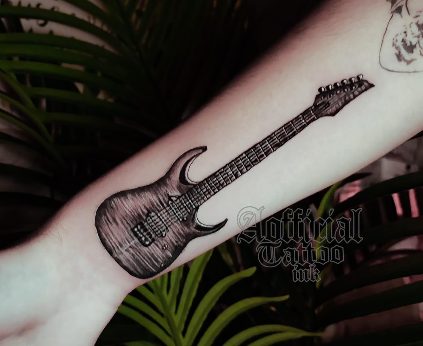 Electric guitar black and grey tattoo on the forearm by Shane Boss, Toronto, Ontario