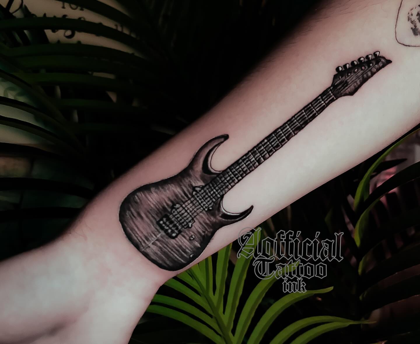 Electric guitar black and grey tattoo on the forearm by Shane Boss, Toronto, Ontario