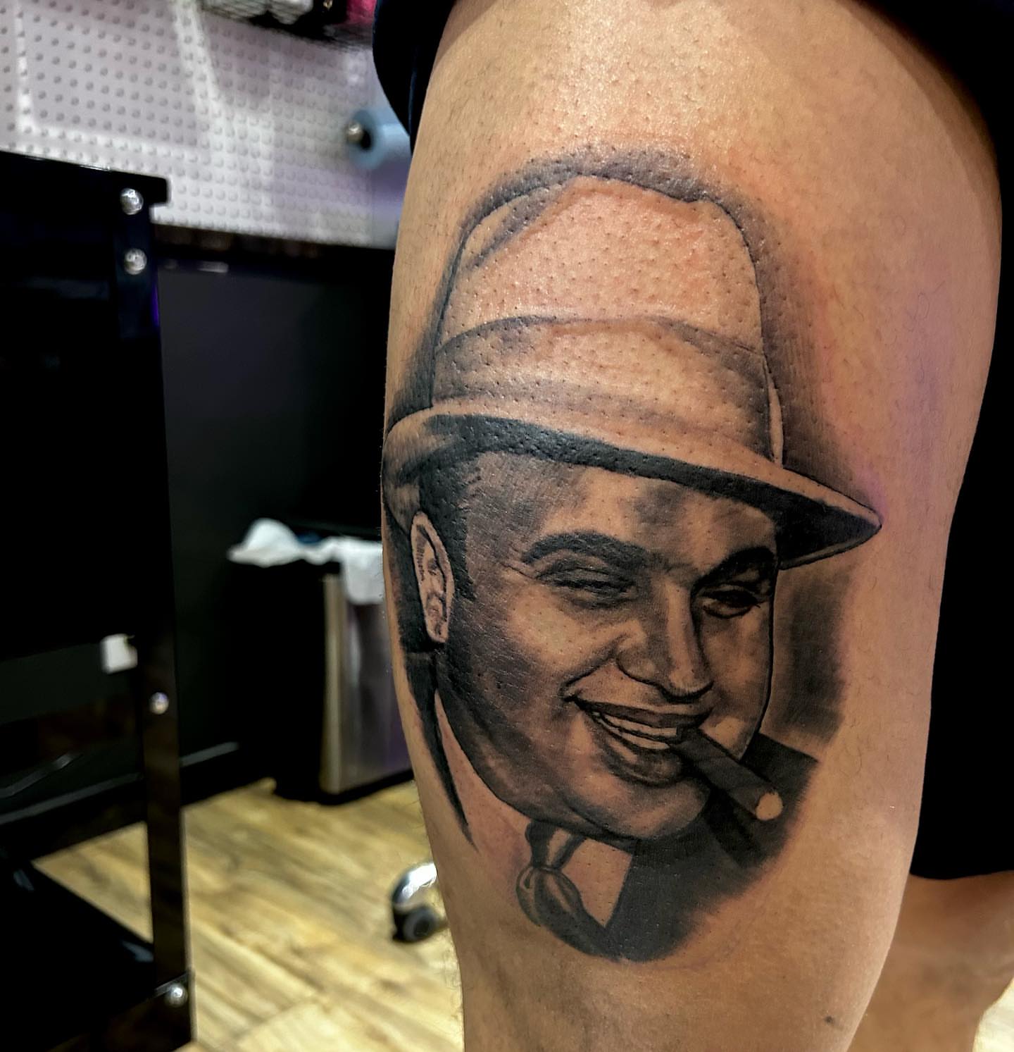 Gangster portrait realism tattoo on the forearm by Cody Lambert