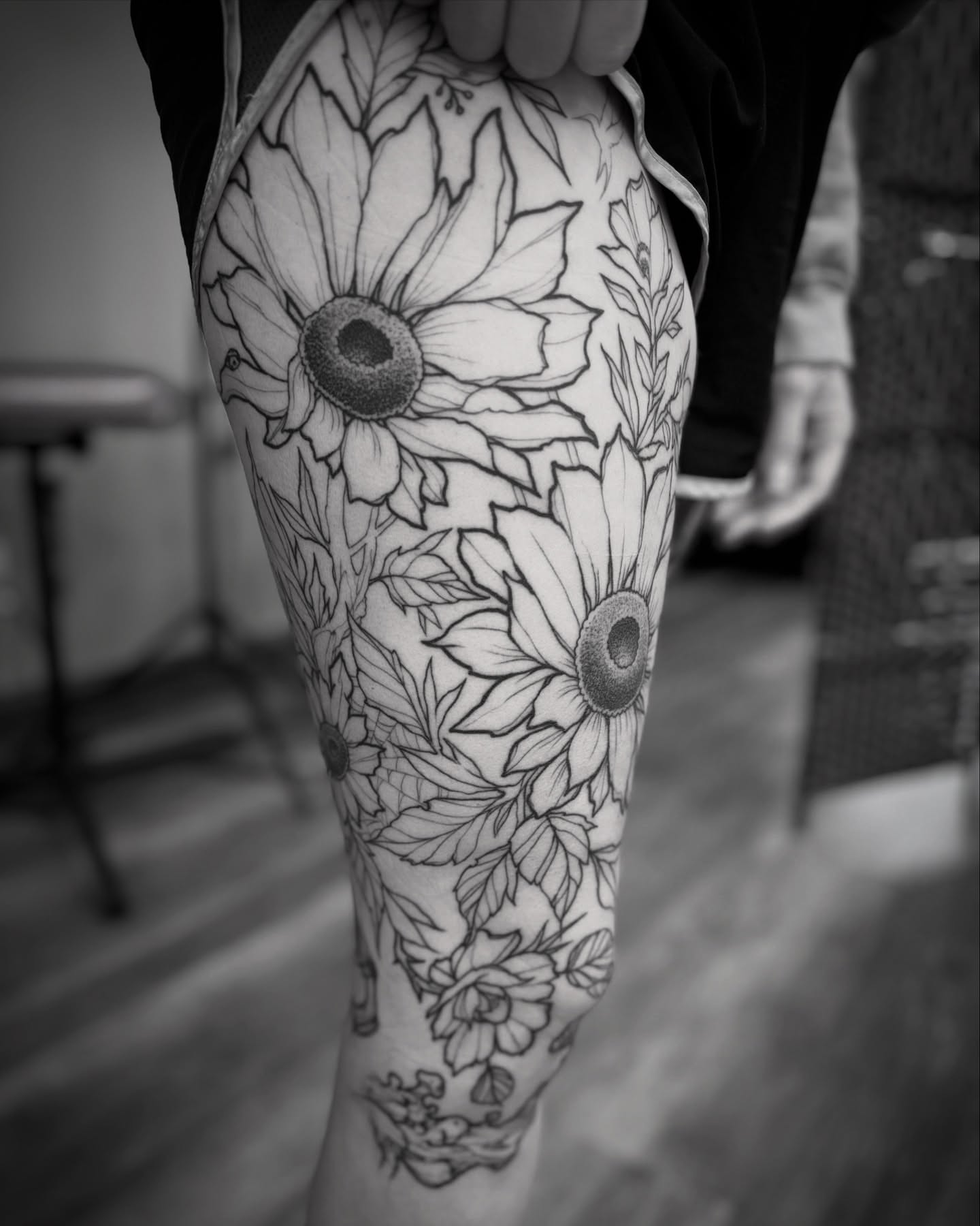 Sunflowers black and grey tattoo on the forearm by Michael Langdale