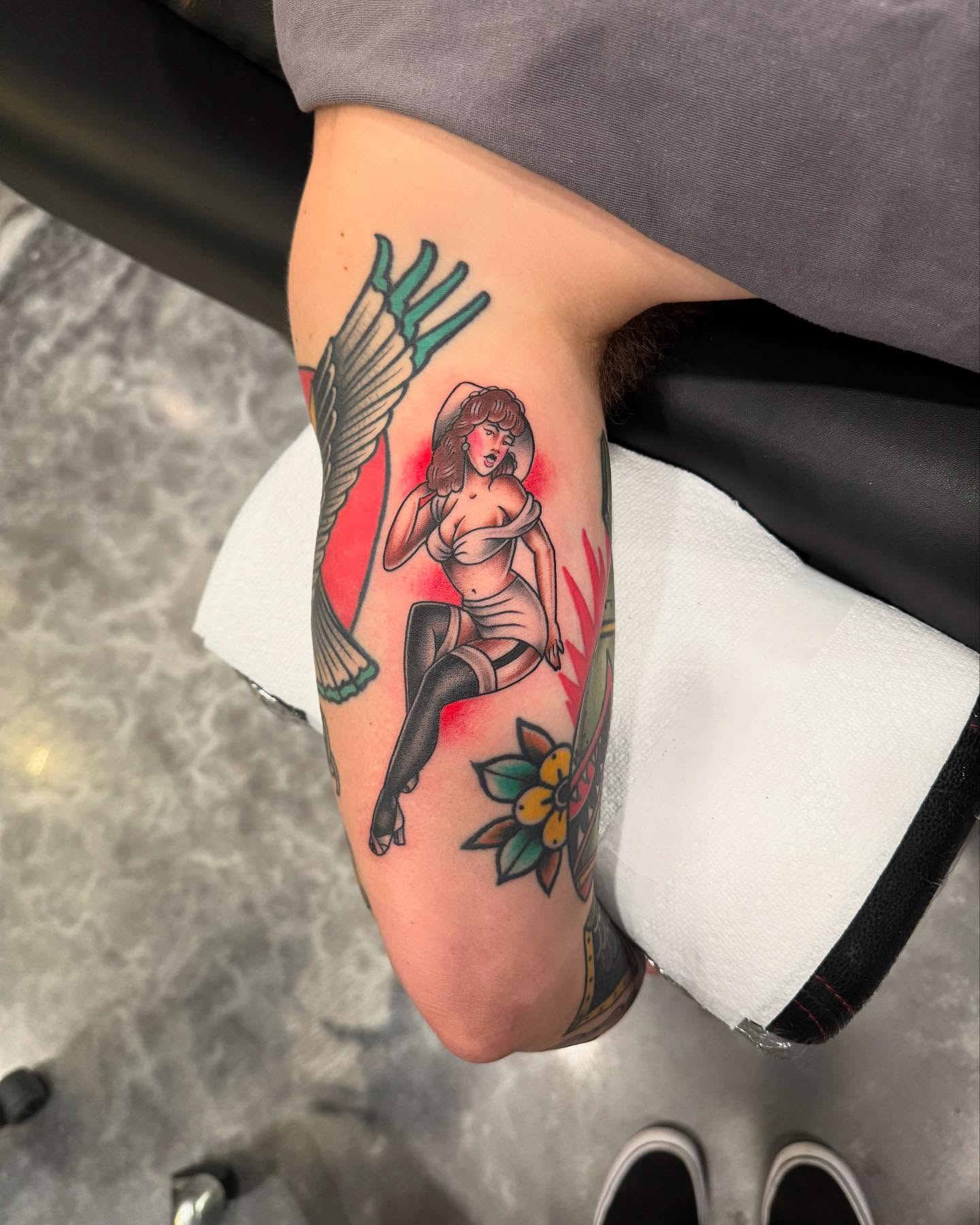 Pin-up girl with wings American traditional tattoo on the forearm by Jay Espinoza-AZ Tattooer