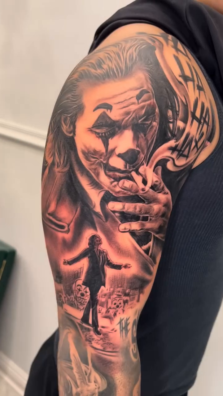Joker portrait with figures realism tattoo by Sloe Rivera