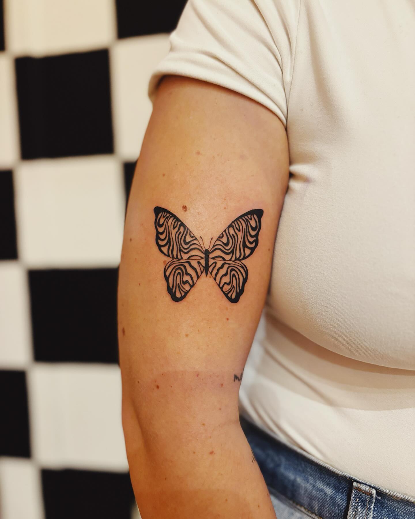 Butterfly black and grey tattoo on the forearm by b i l l i e, Seattle, Washington