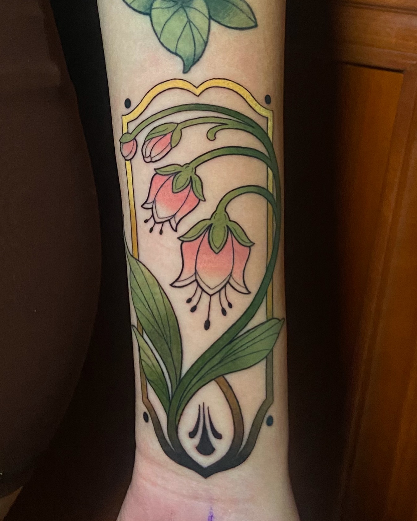 Bell flowers new school tattoo on the forearm by Alicia