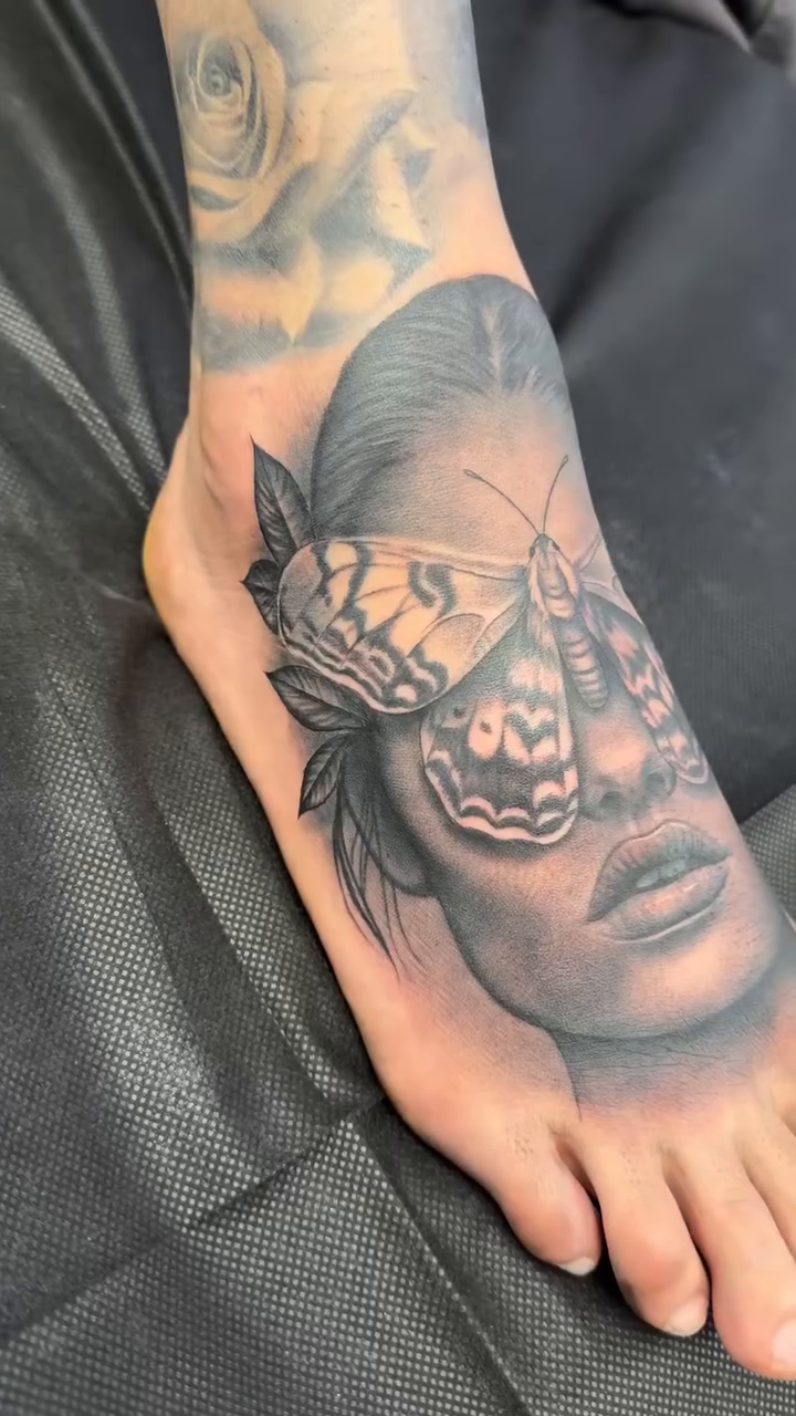 Woman with butterfly mask realism tattoo by Fernando Andrade Jr
