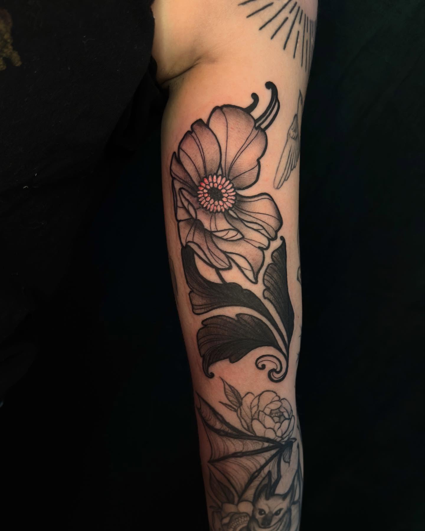 Flower black and grey tattoo on the forearm by Jessica Haug