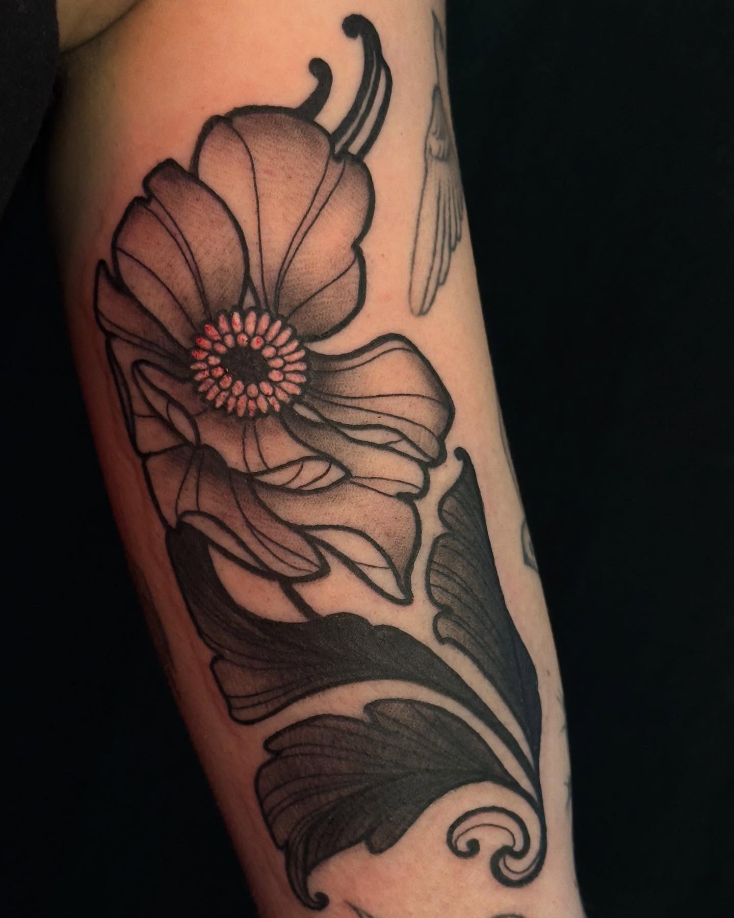 Flower black and grey tattoo on the forearm by Jessica Haug