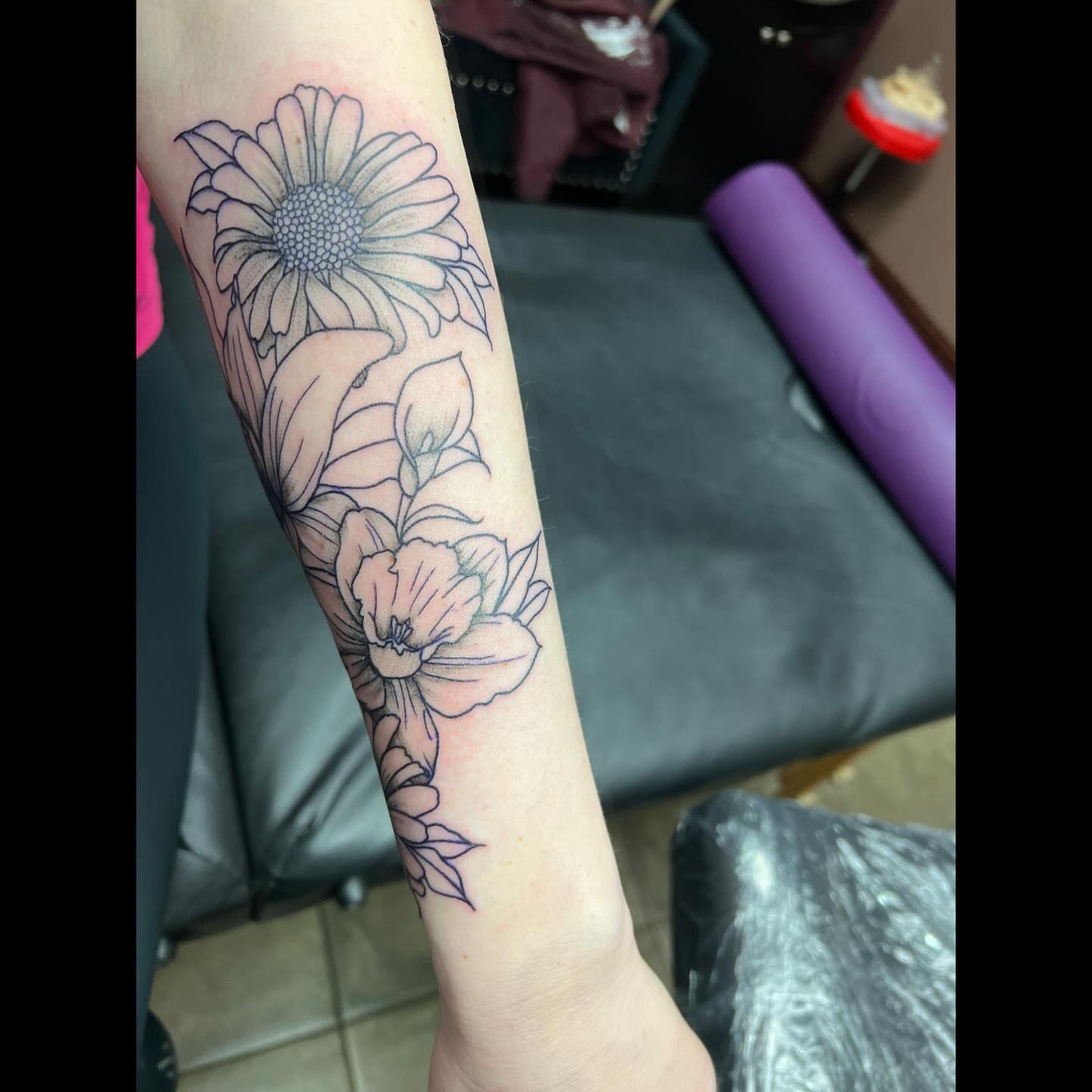 Flowers black and grey tattoo on the forearm by Ali, Cedar Rapids, Iowa
