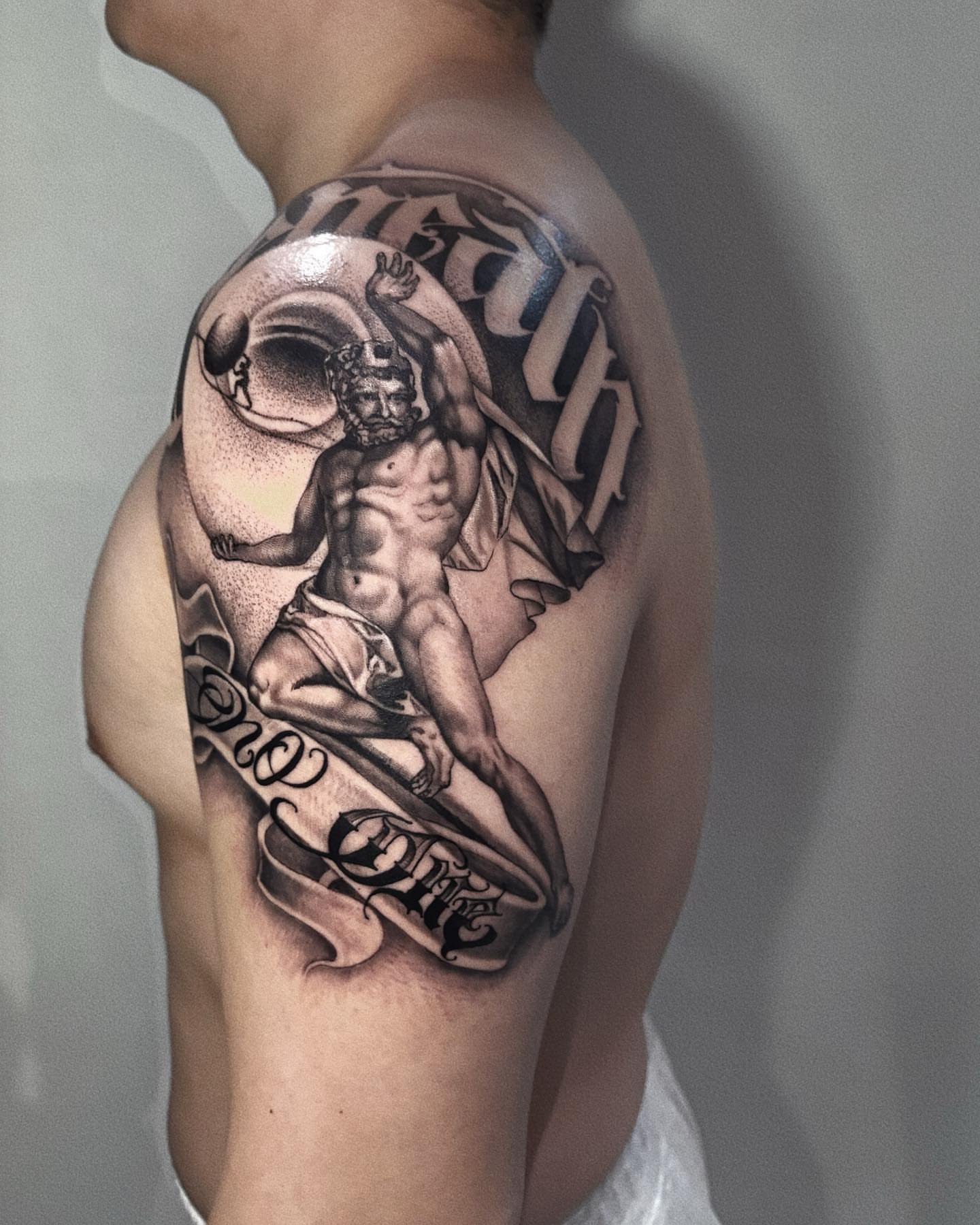 Mythological figure black and grey tattoo on the shoulder by Duo