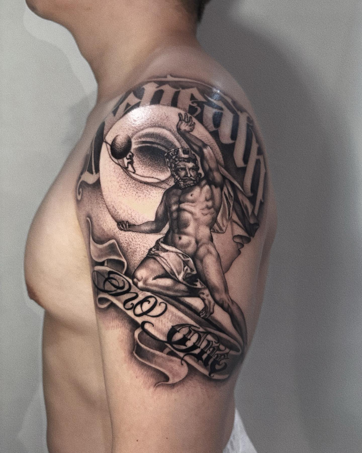 Mythical figure dotwork tattoo on the shoulder by Duo
