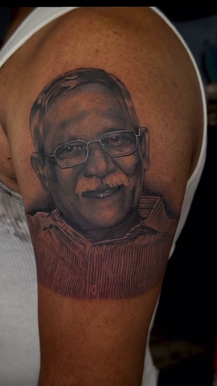 Portrait of a man realism tattoo by Greg Petrali