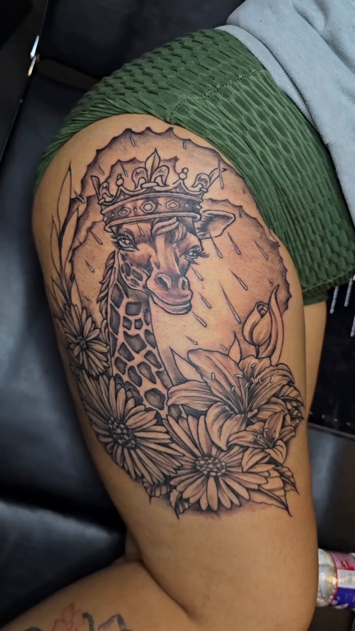 Giraffe with flowers realism tattoo by call (504)441-9275 for info