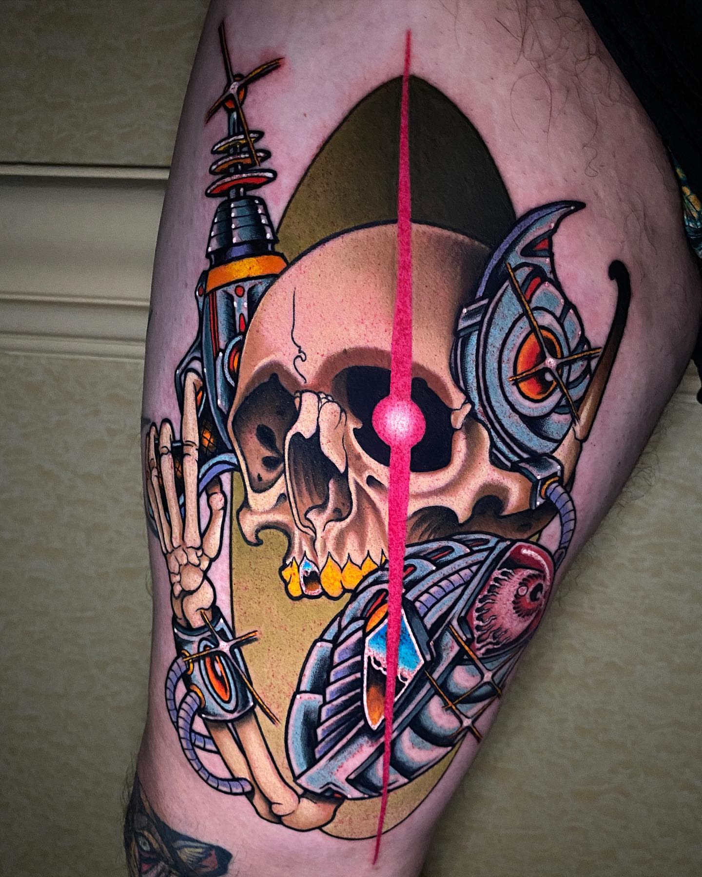 Cyborg skull American traditional tattoo on the thigh by Jade Napier