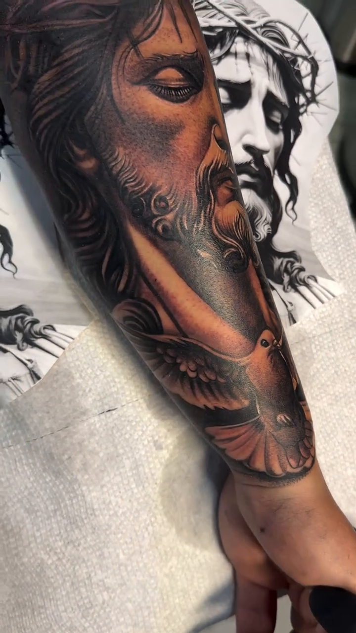 Jesus Christ and dove realism tattoo by Tattoo