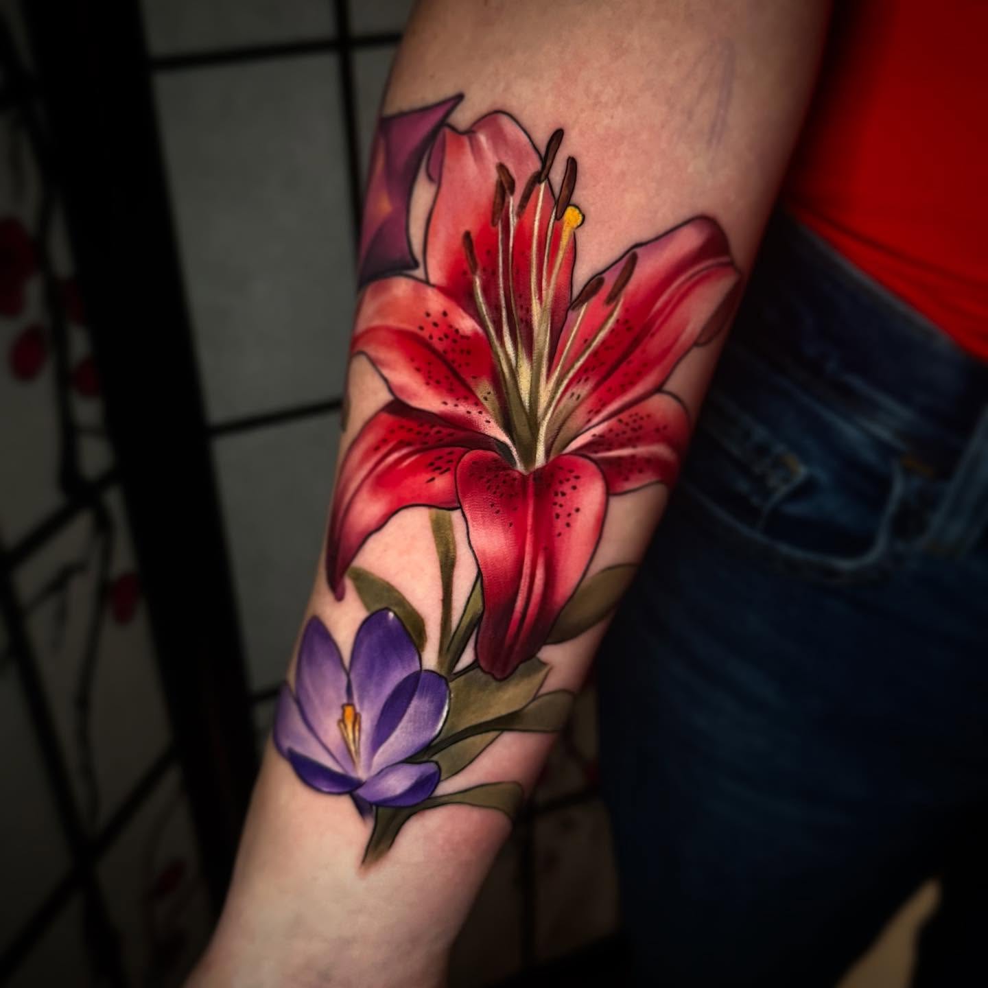 Lily and crocus realism tattoo on the forearm by Bruce becerra tattoos