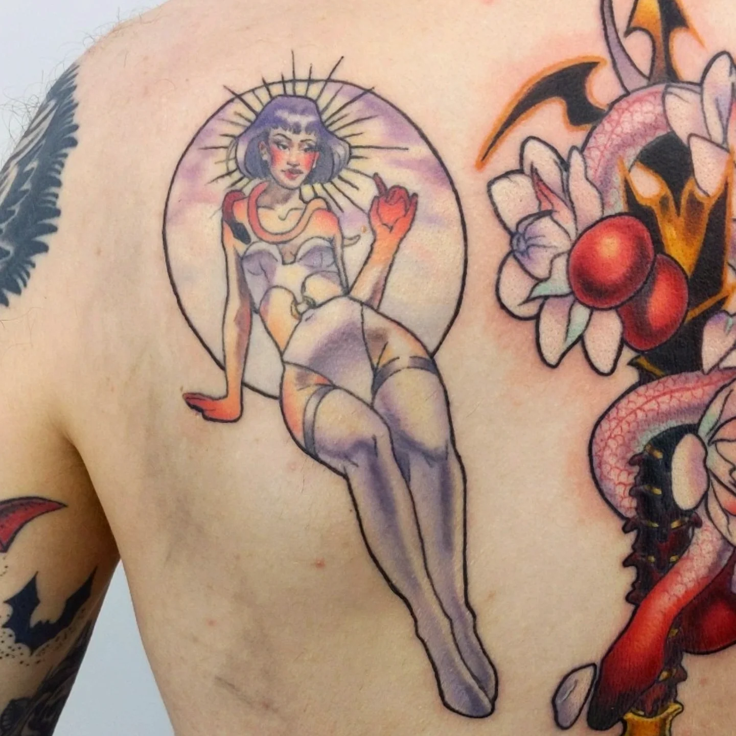 Pin-up girl American traditional tattoo on the back by Lahel (Lay-el) Fowler