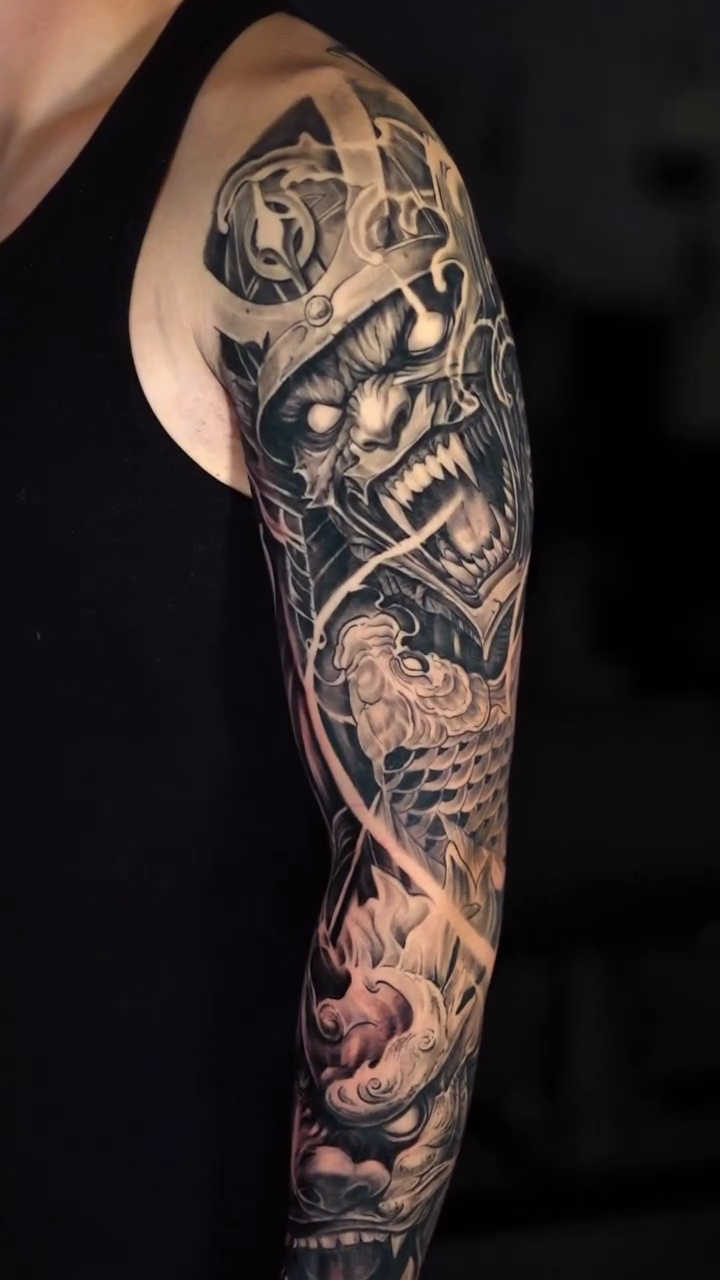 Demon mask and mechanical parts dark realism tattoo by Loi Nguyen