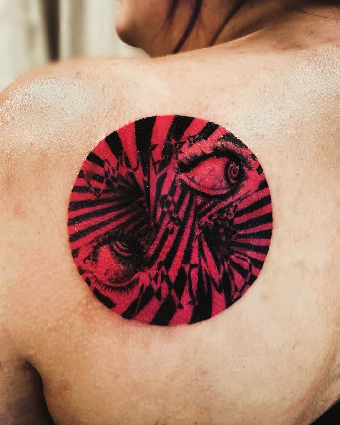 Eye and spiral geometric tattoo on the chest by Bennie Bae