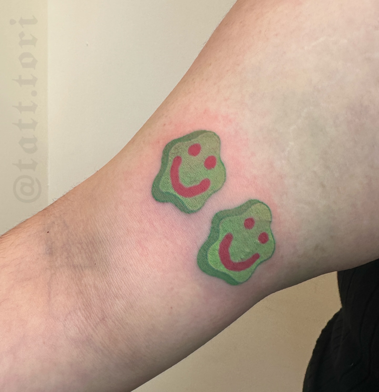 Smiley faces dotwork tattoo on the forearm by 𝔱𝔬𝔯𝔦