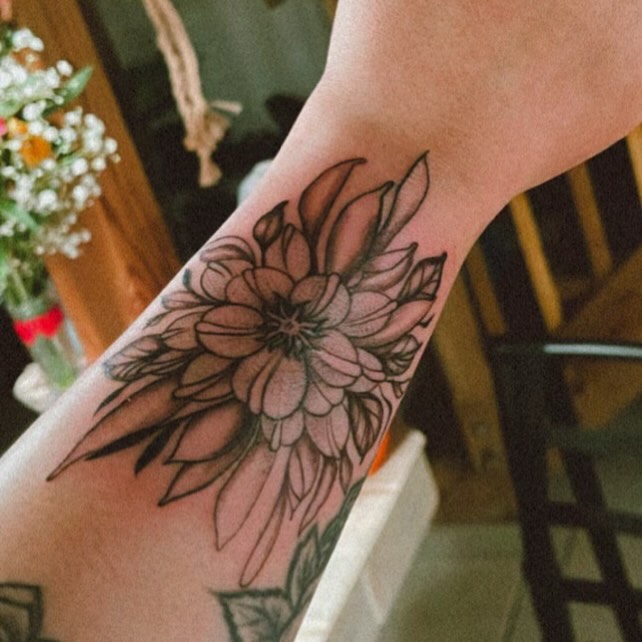 Flower black and grey tattoo on the forearm by Sonia vidal