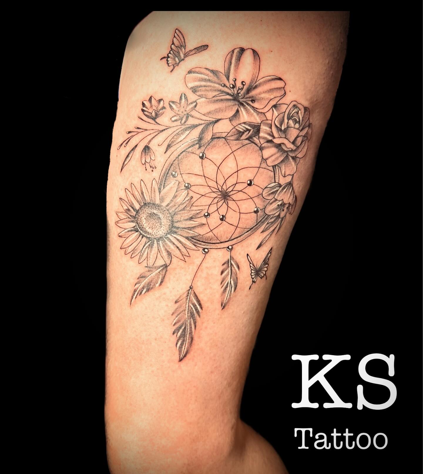 Dreamcatcher with flowers dotwork tattoo on the forearm by Karen Smith